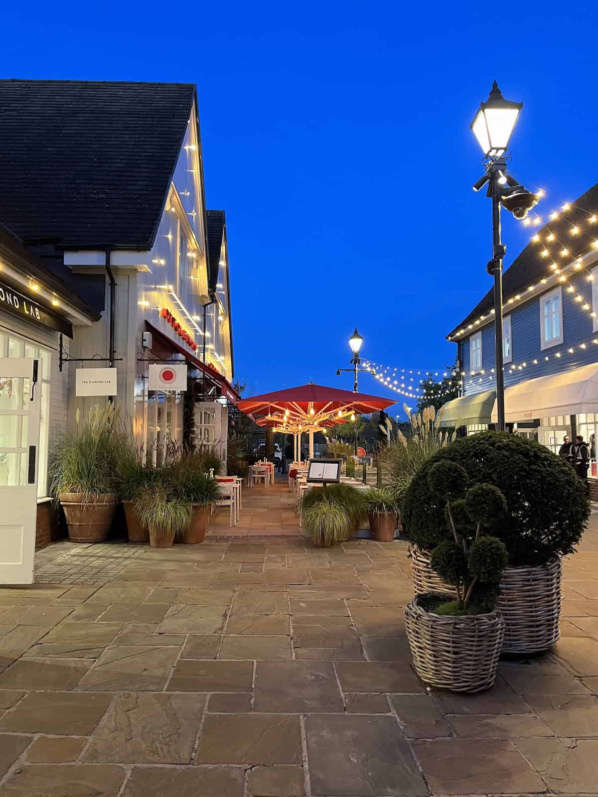 Bicester Shopping Village at night.